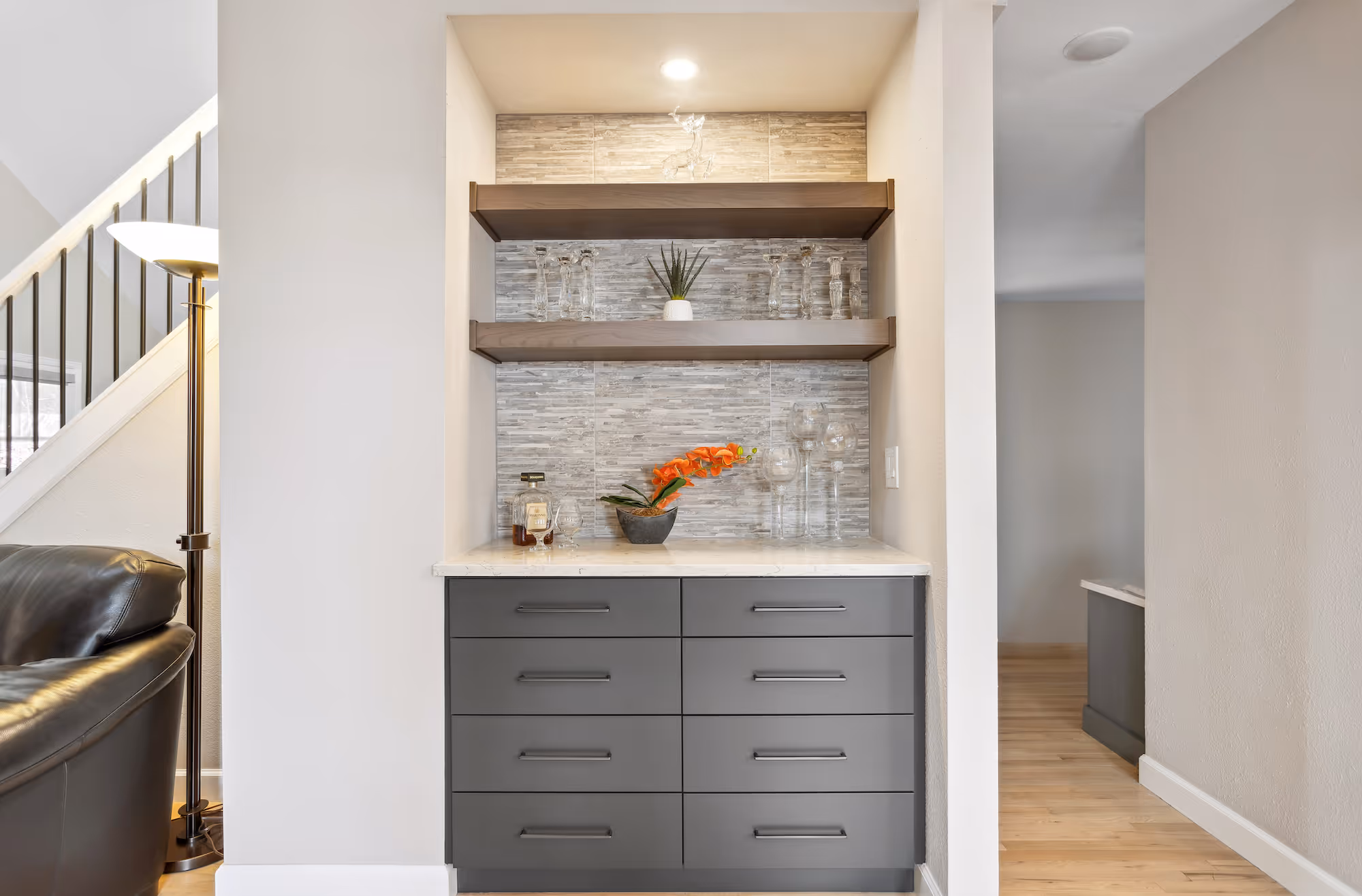 Cozy bedroom nook with built-in desk and shelving for a functional space.