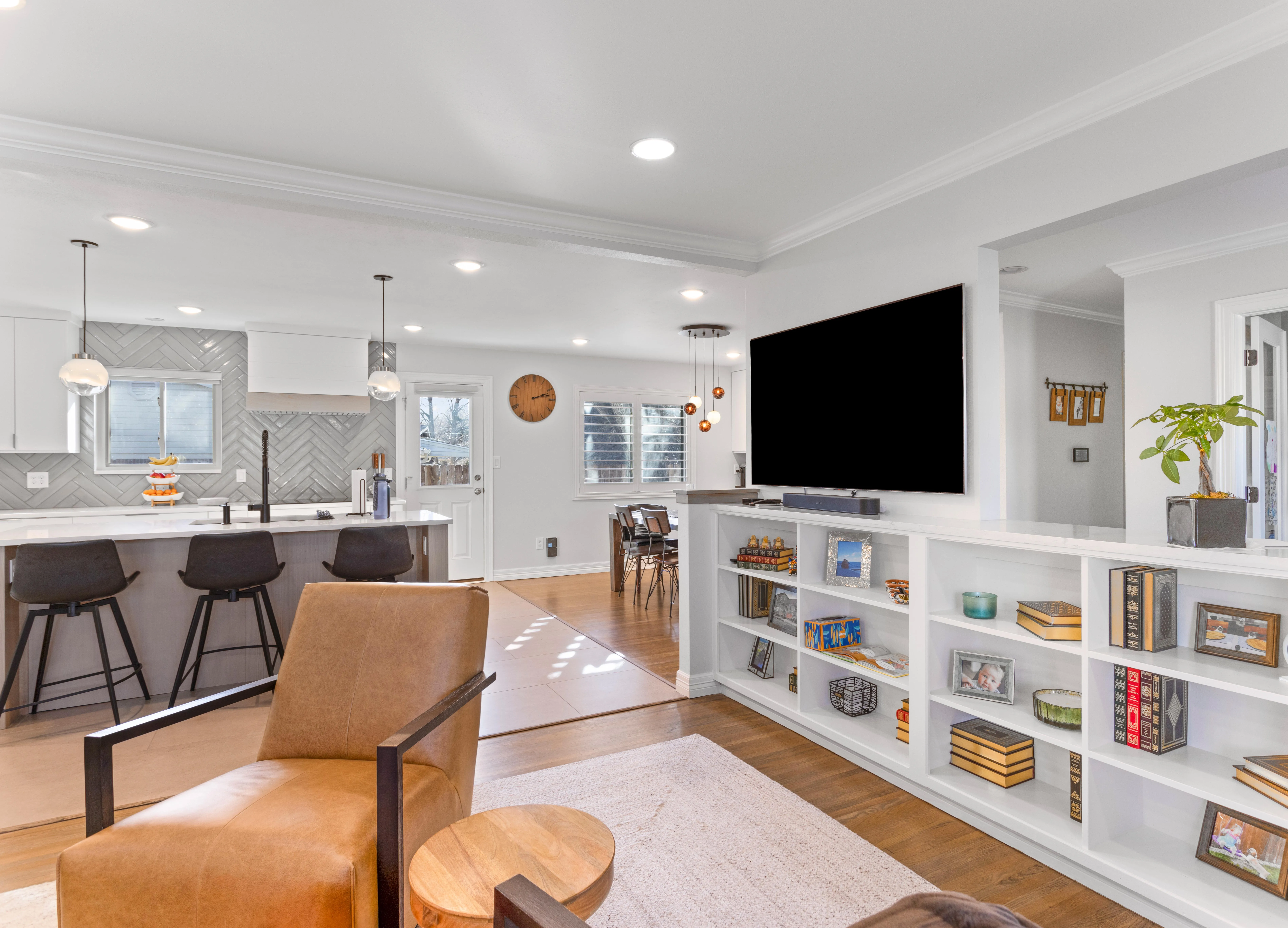 White kitchen renovation with island seating