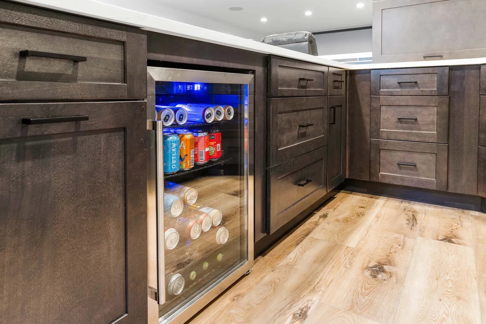 Basement wet bar with blue tile backsplash and beverage fridge, Littleton