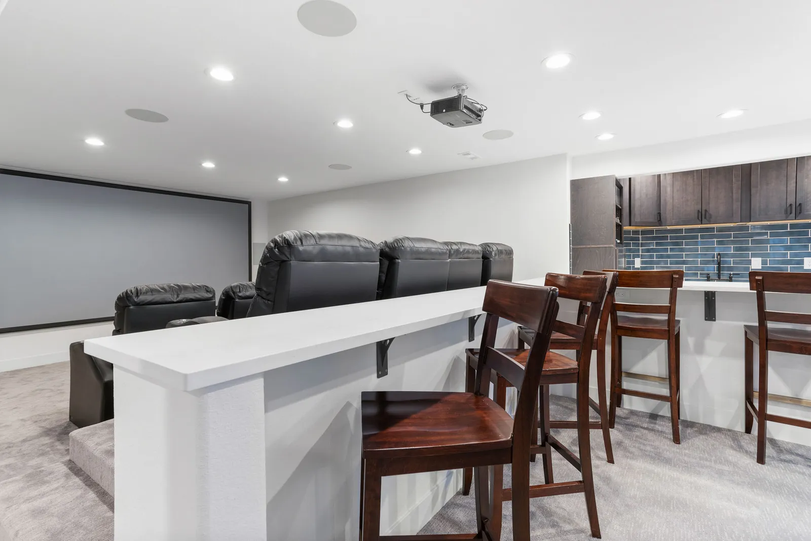 Home theater projector screen in a finished Littleton basement