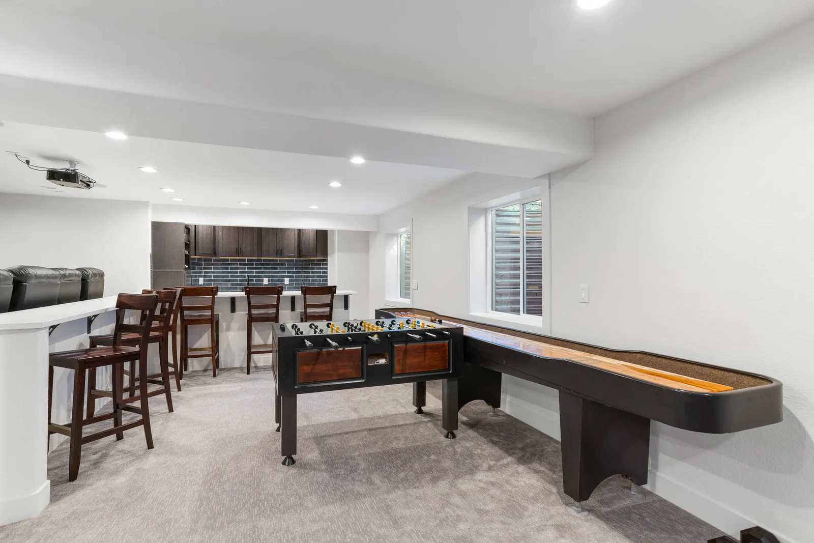 Home gym with treadmills in a finished Littleton basement
