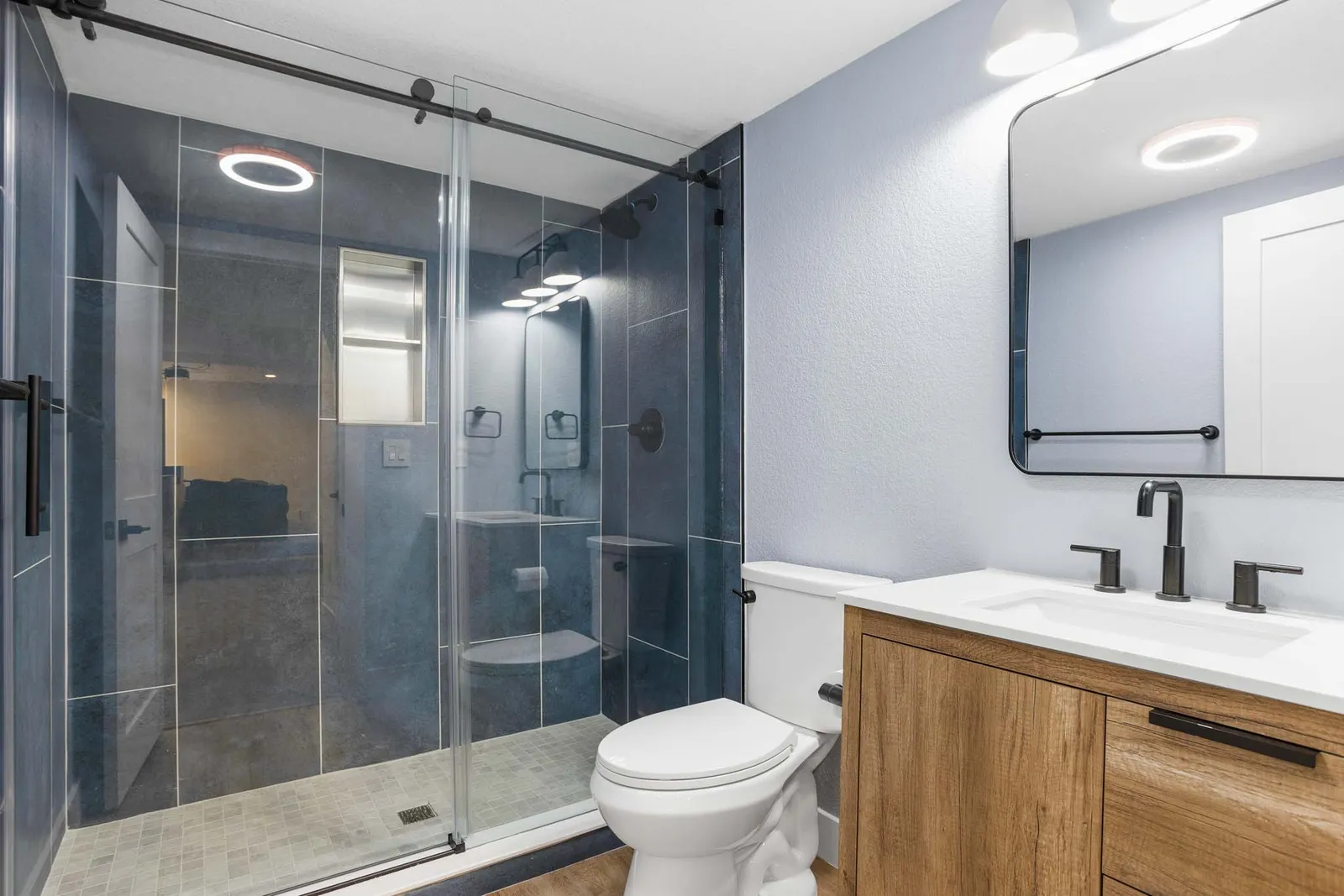 Basement full bathroom with frameless glass shower, Littleton