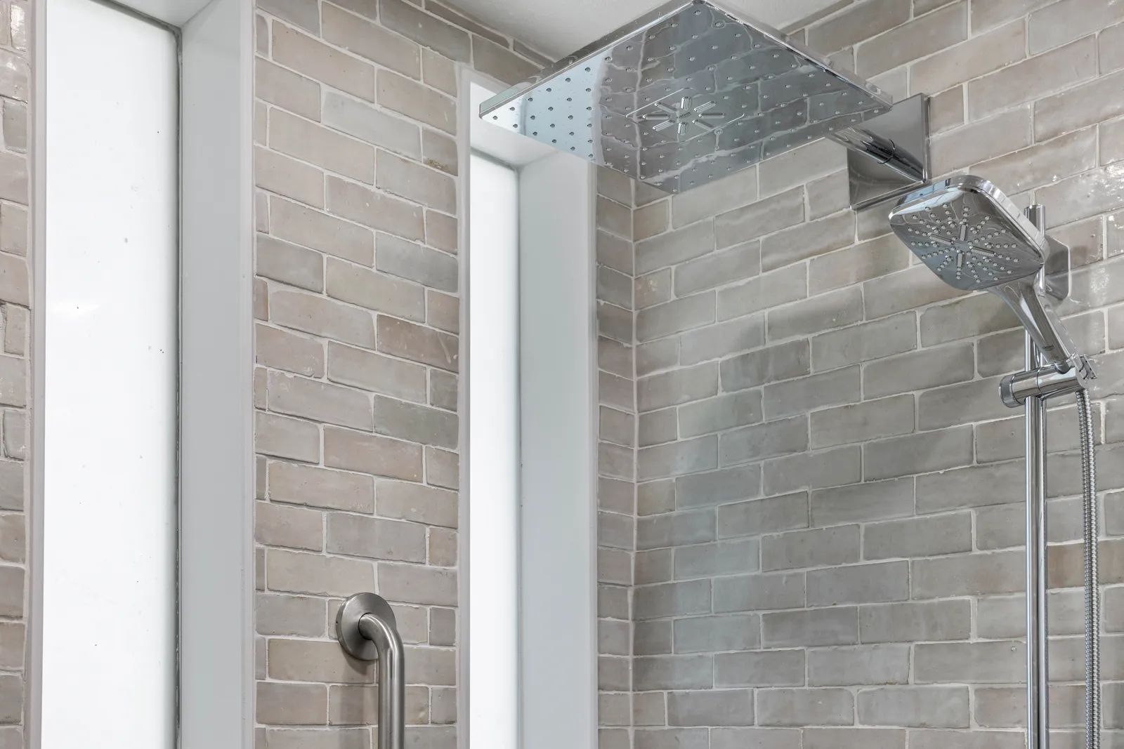 Wood vanity with quartz counter in an accessible Centennial bath