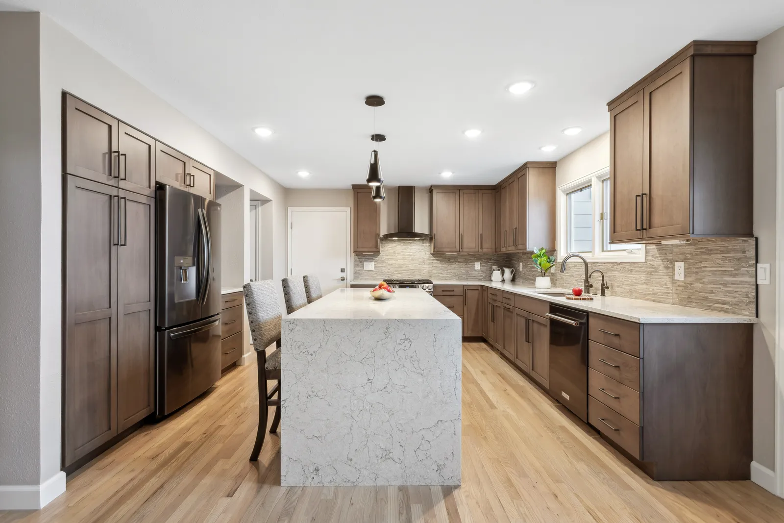 Denver Tech Center townhome kitchen remodel with stained cabinets and quartz island