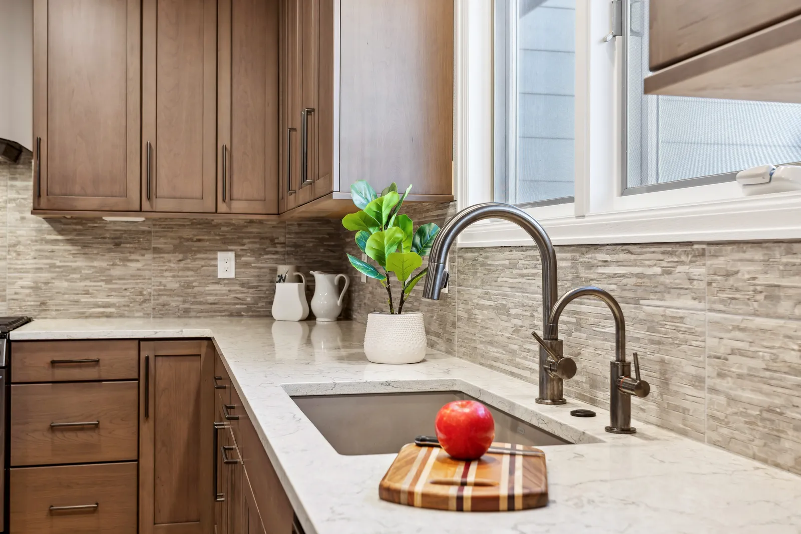Quartz counter with stone backsplash and undermount sink, Denver kitchen