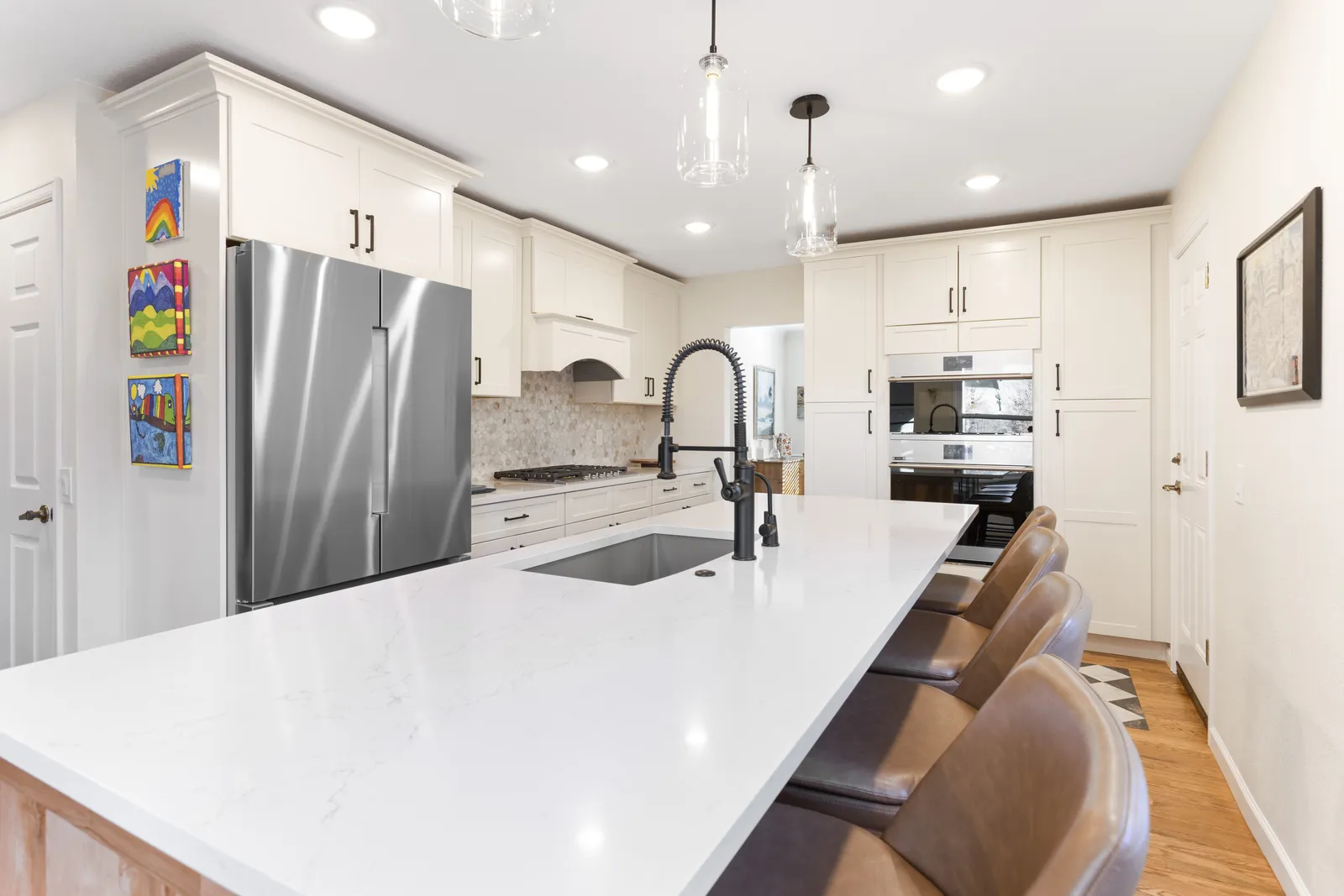 Walnut waterfall island with white quartz, Englewood CO kitchen