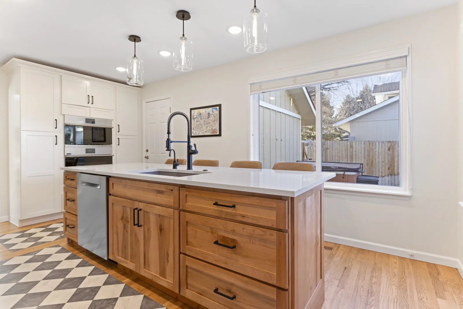 Walnut island open to windows, remodeled Englewood kitchen