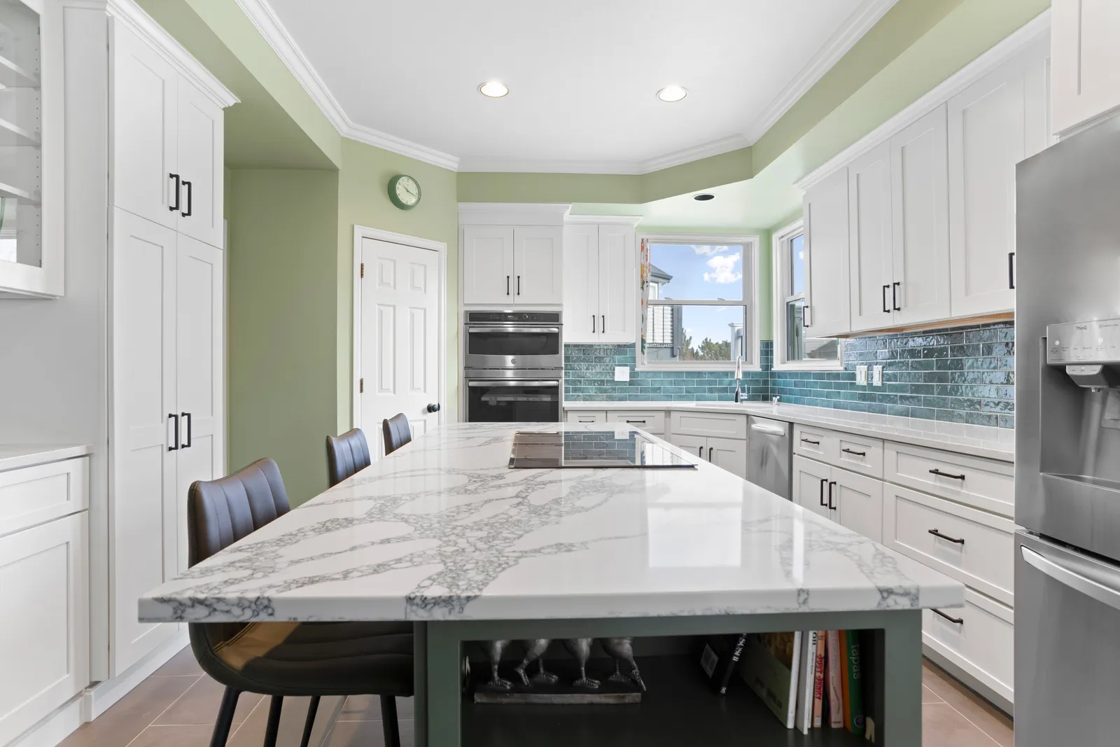 Marble-look waterfall quartz island in a Northridge kitchen renovation