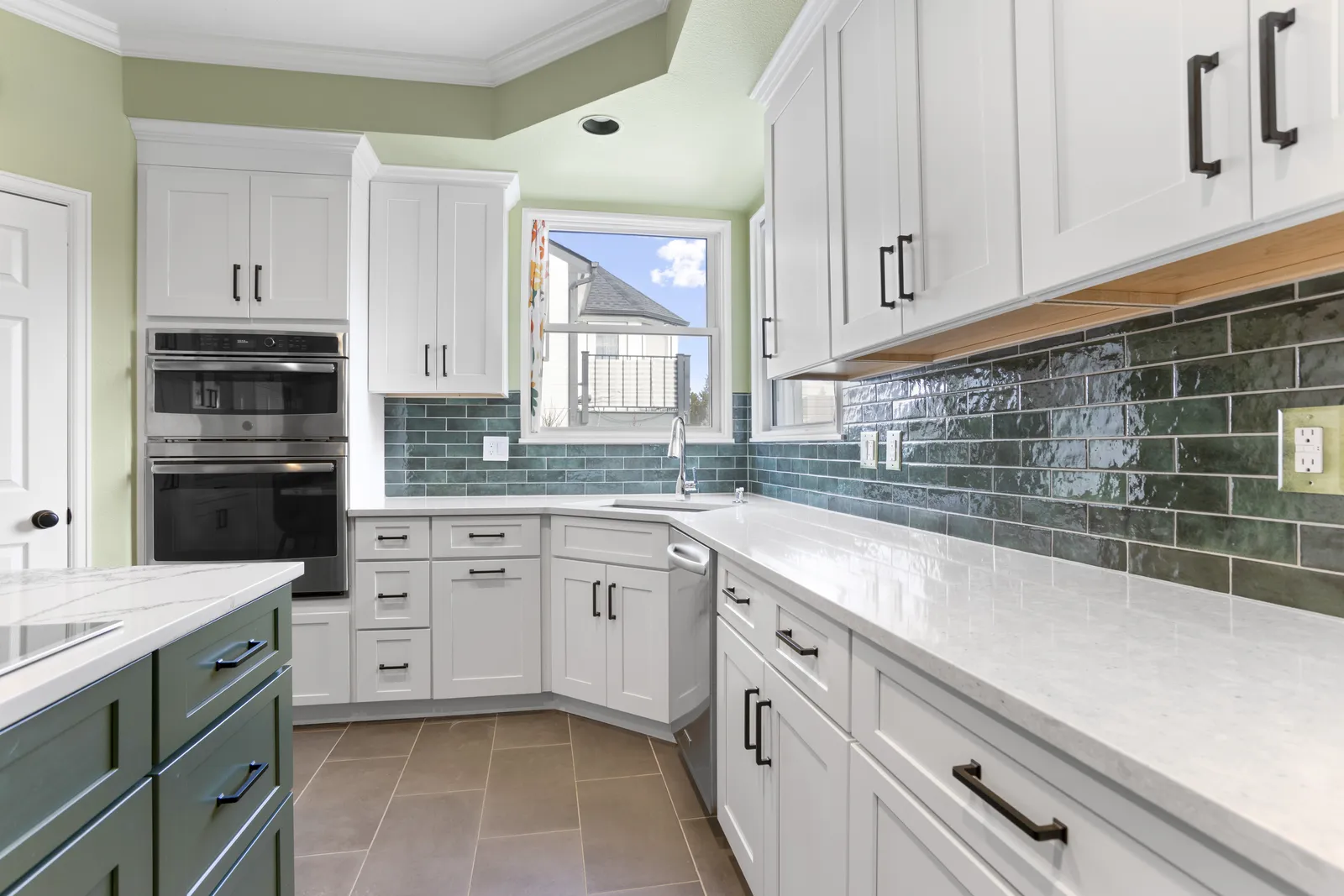 Teal glass tile backsplash and built-in ovens, Highlands Ranch kitchen
