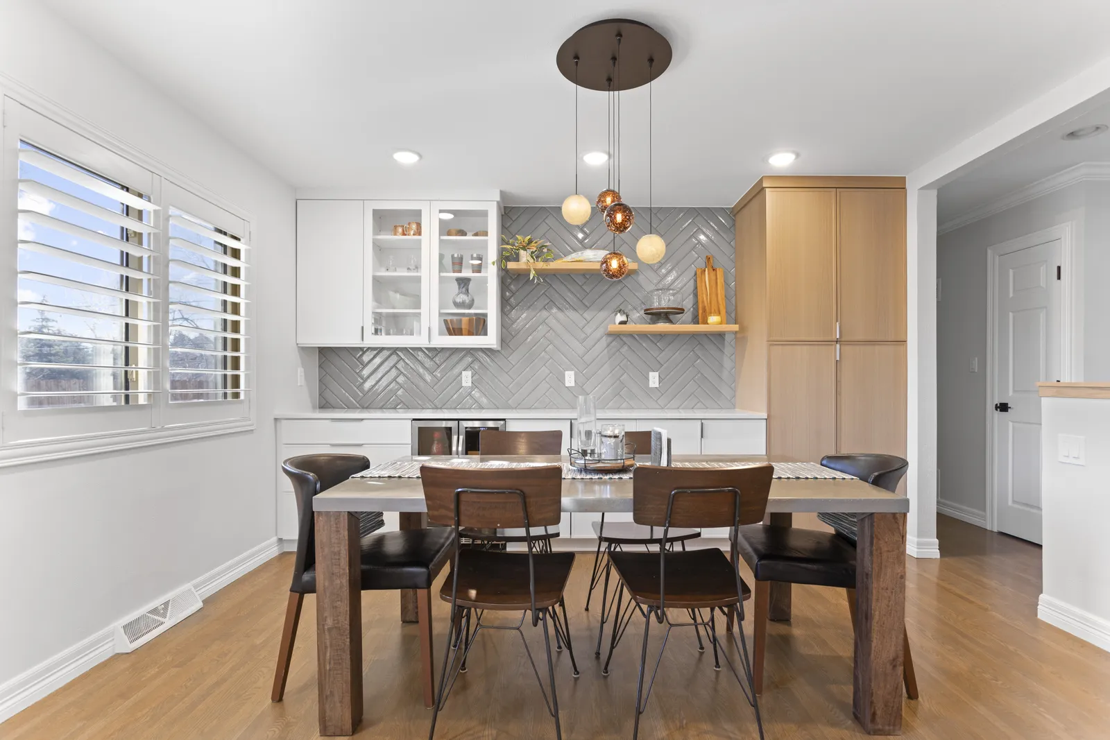 Dining room with glass-front cabinets and globe chandelier, Cherry Knolls Centennial
