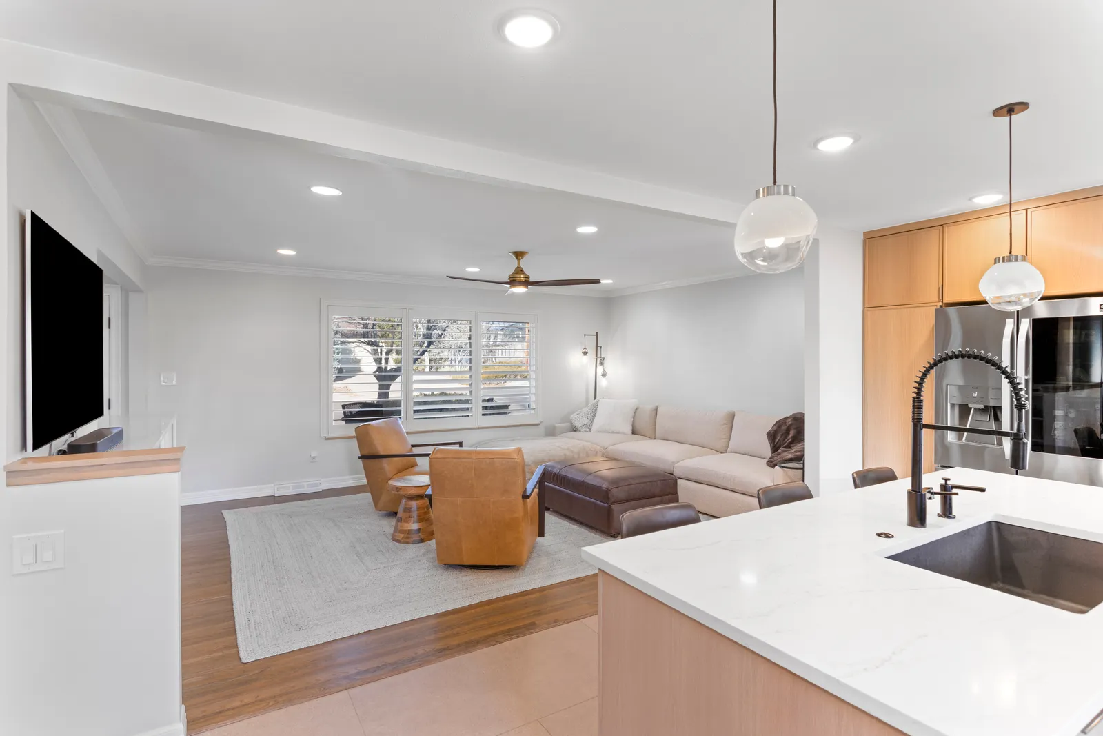 Open-concept living room and kitchen after main floor remodel, Centennial CO