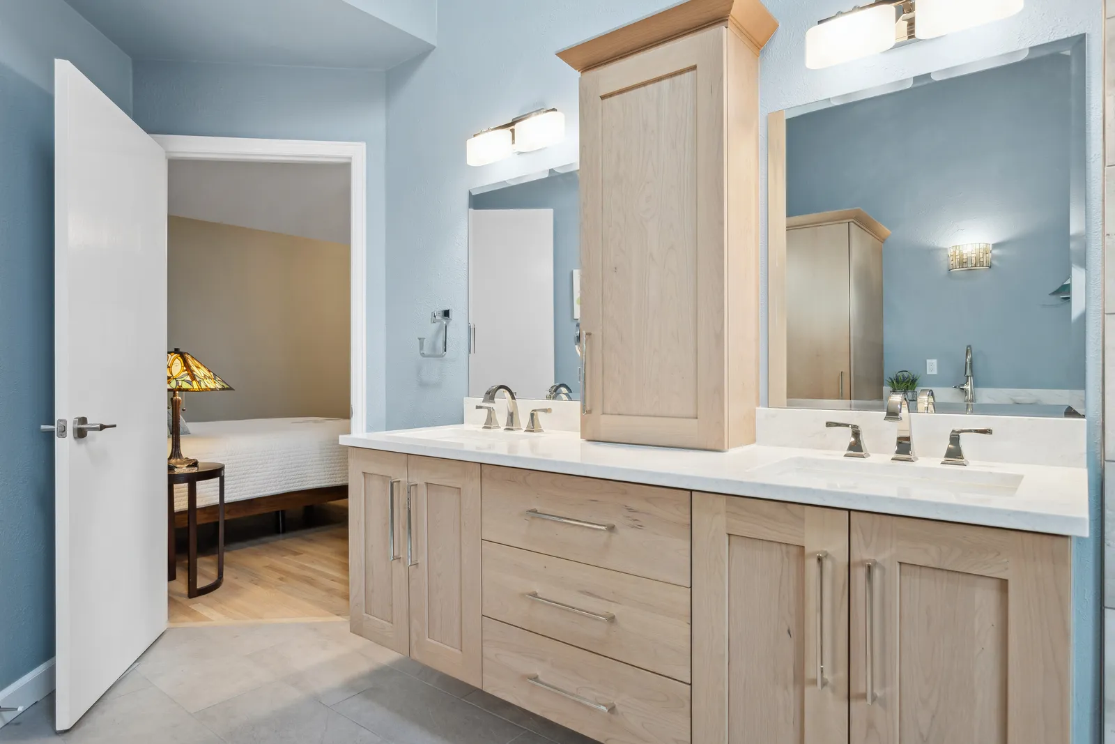 Oak double vanity with quartz counters and tower cabinet, Denver bath