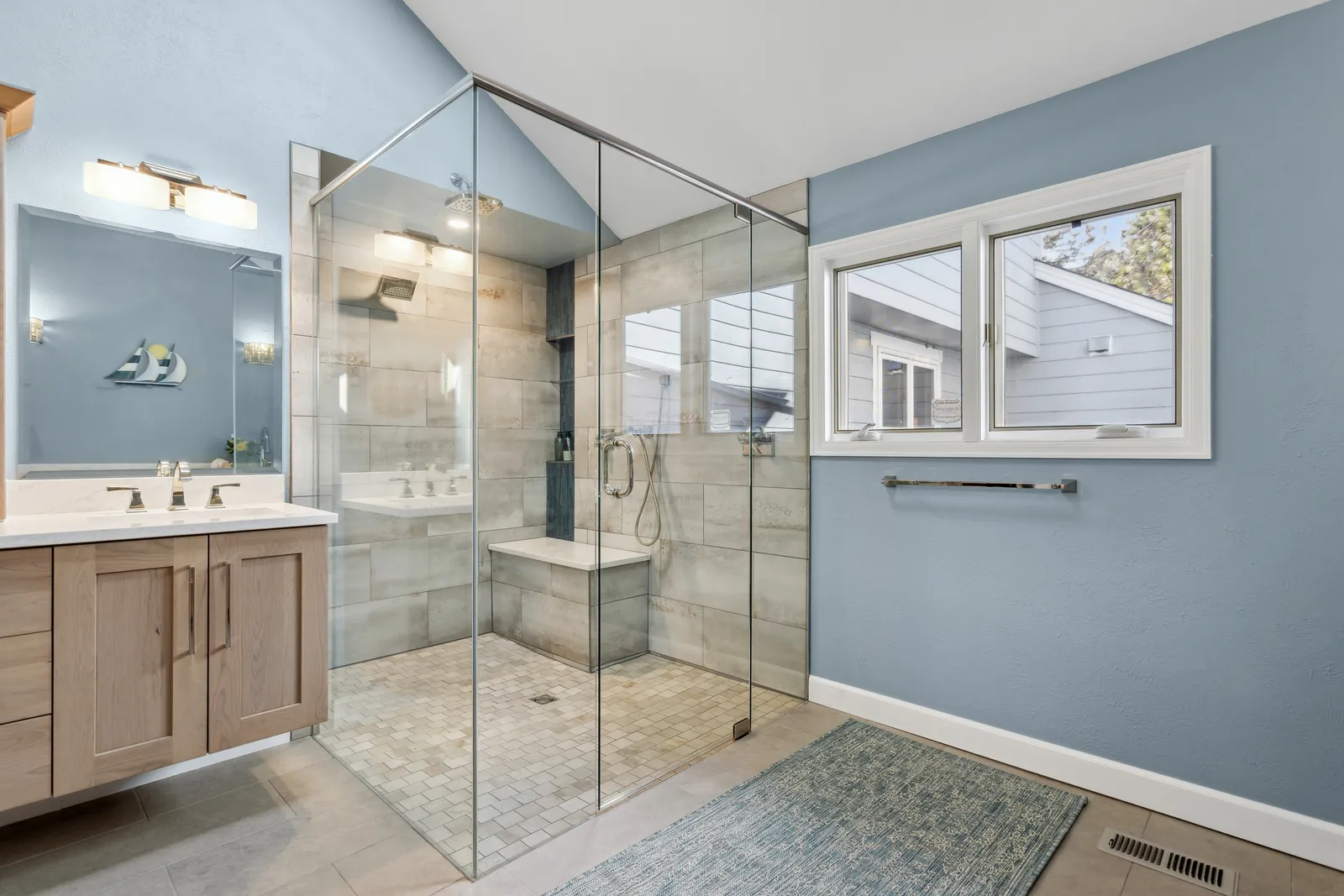 Blue-gray master bath with glass shower, Denver remodel