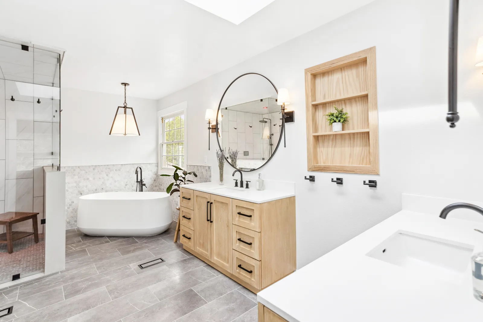 Englewood master bath with freestanding tub and marble tile