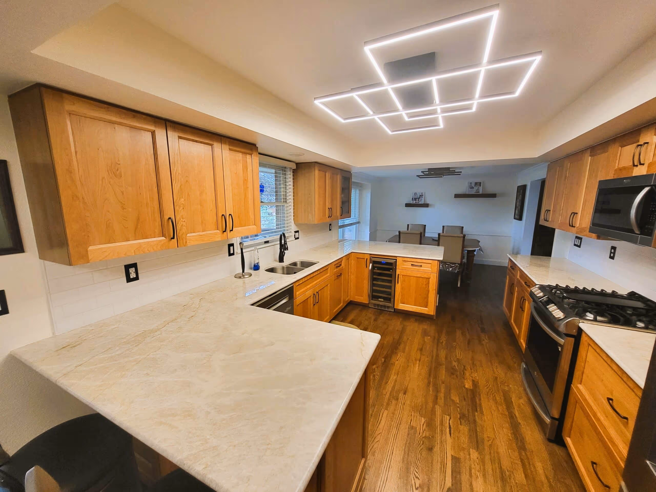 Bright white kitchen with a large window