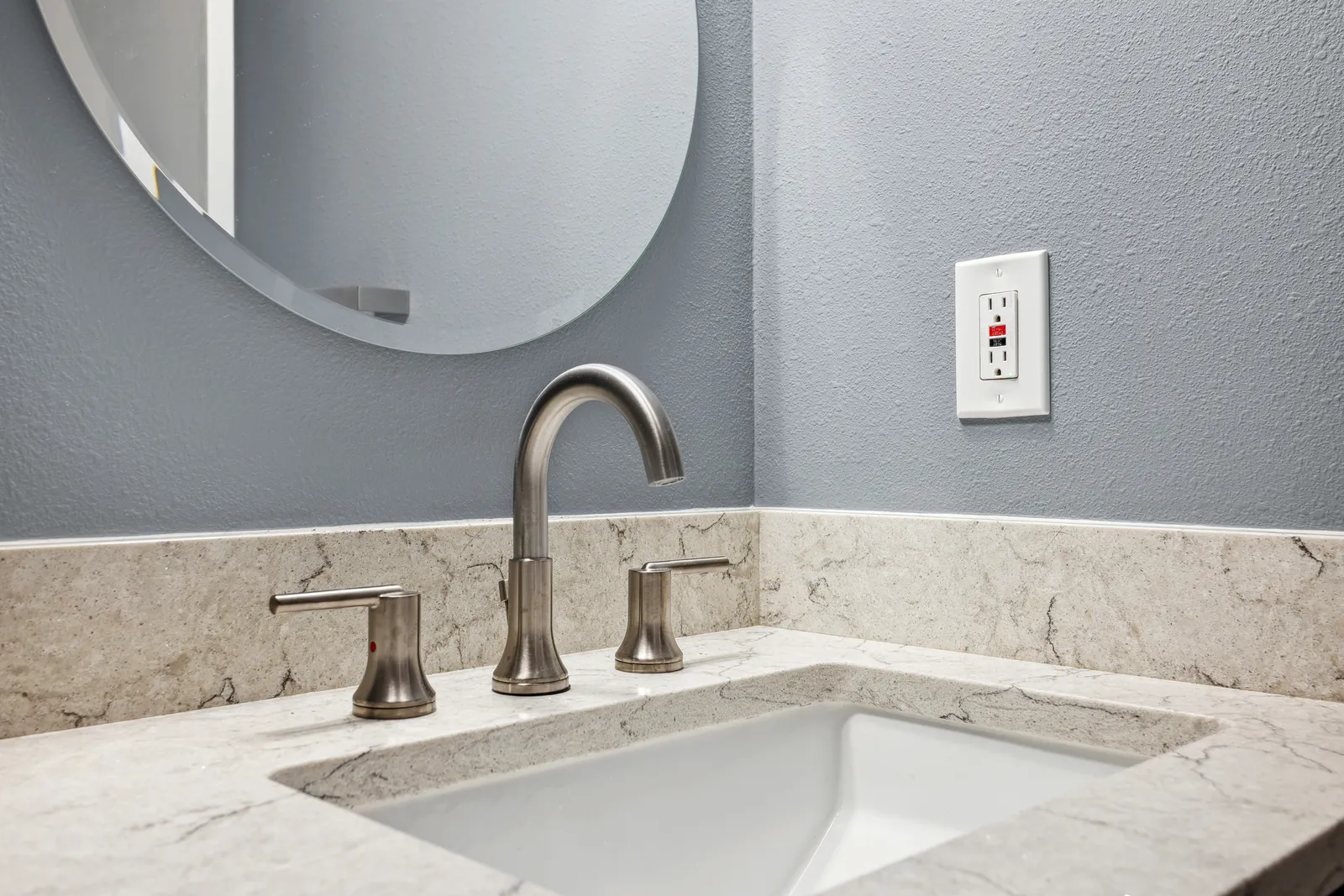 Undermount sink with marble-look counter, Denver powder room