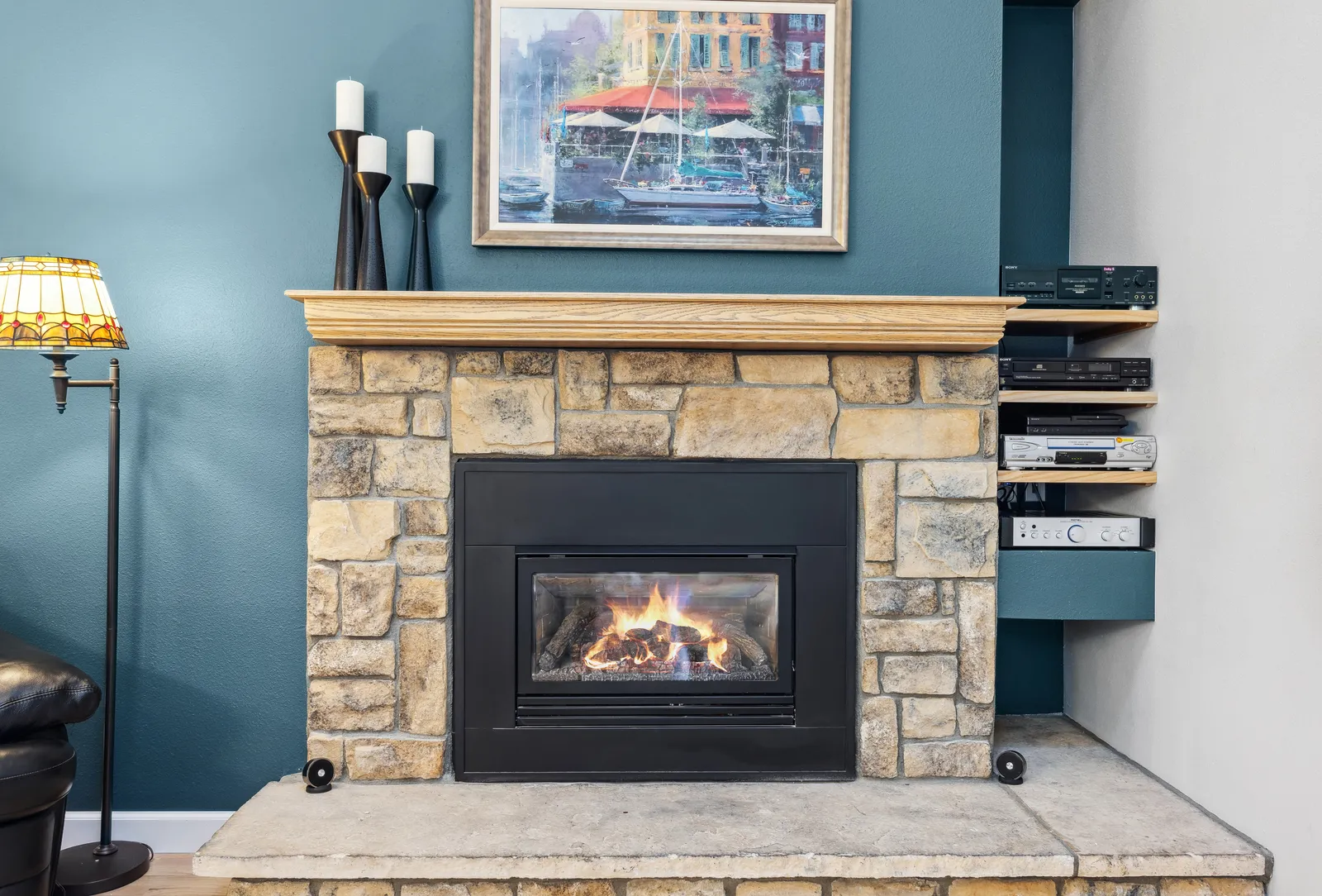 Stacked-stone gas fireplace in a remodeled Denver living room