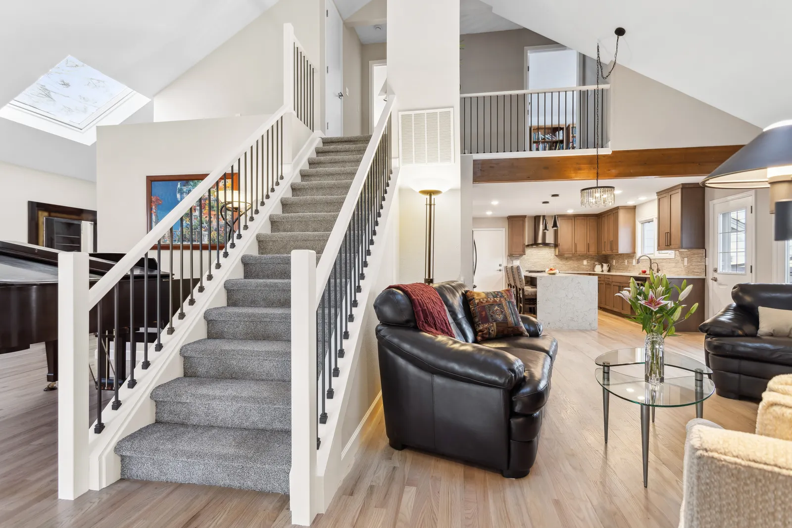Open staircase with iron balusters and carpet runner, Denver Tech Center