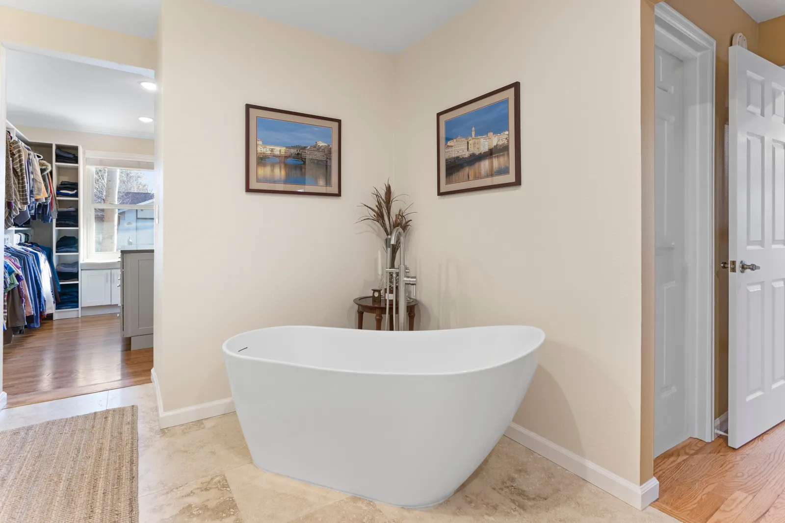 Freestanding soaking tub in a remodeled Englewood primary bath
